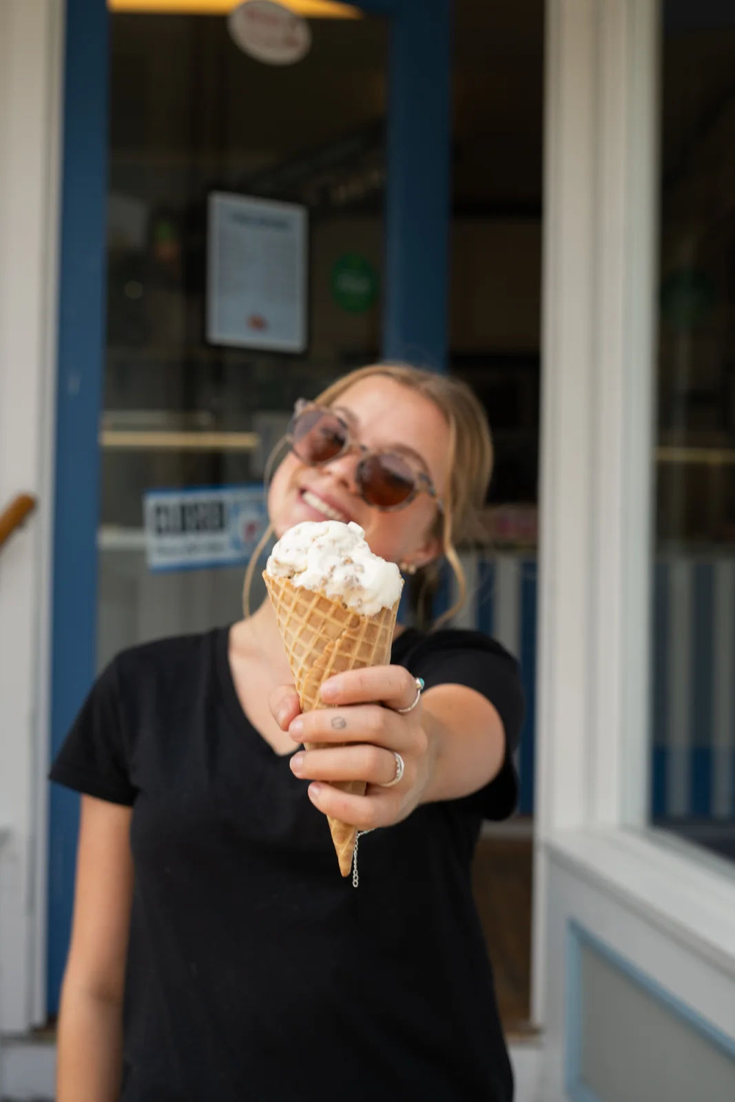 A customer enjoying a Willard Scoops ice cream cone