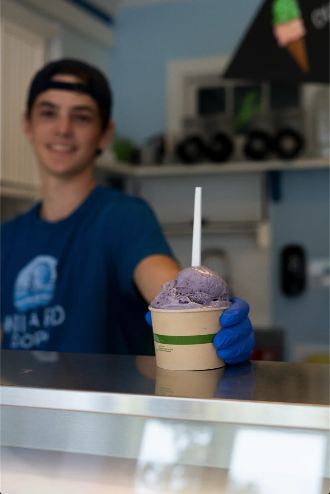 A Willard Scoops team member serving ice cream